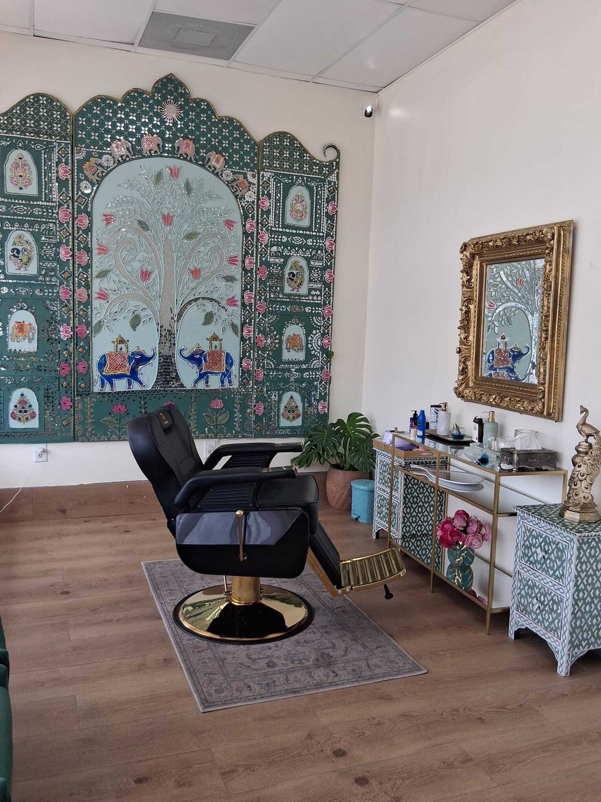 The Jaipur mirror-work panel beside a gold framed mirror and inlaid cabinet