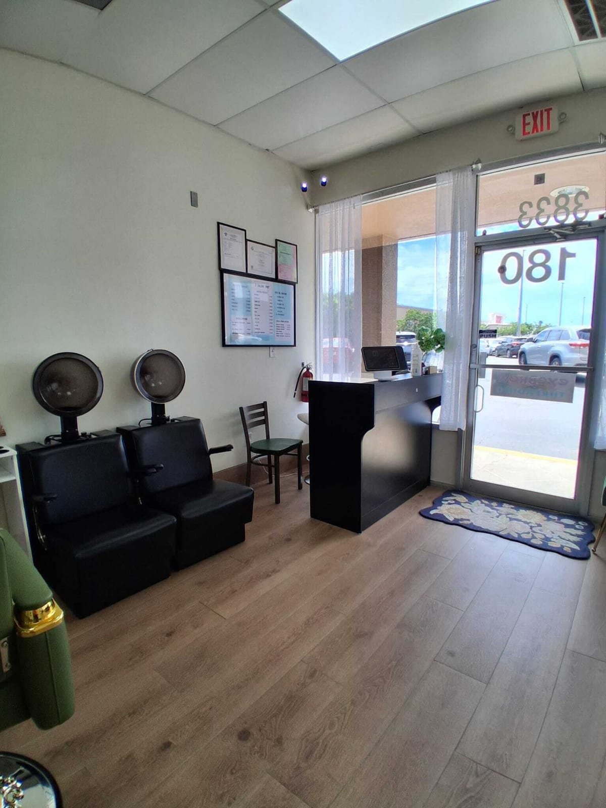 The reception desk and waiting area with hood dryers